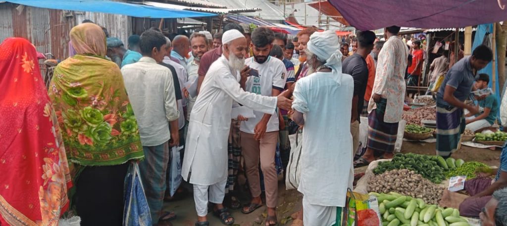 UP Chairman candidate Tuku Chowdhury distributes leaflets in Kalai